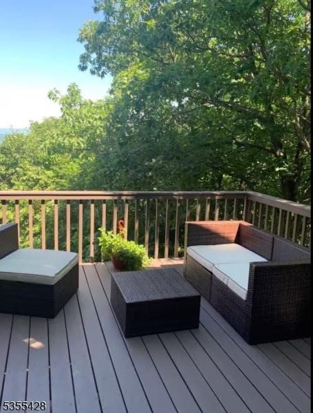 deck featuring outdoor lounge area