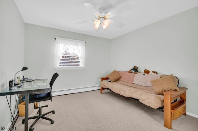carpeted home office featuring a baseboard radiator, a ceiling fan, and baseboards