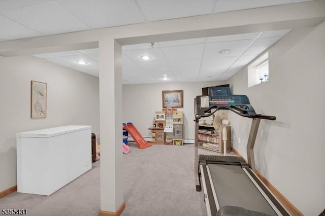 workout area with carpet floors, a paneled ceiling, recessed lighting, and baseboard heating