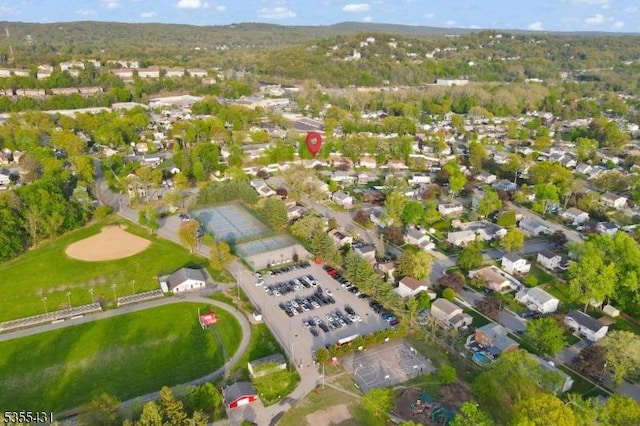 aerial view of property's location featuring nearby suburban area
