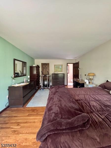 bedroom with light wood-type flooring