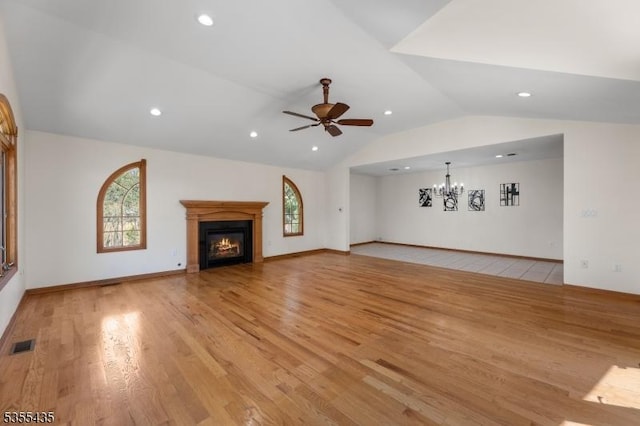 1296 Millstone River Rd, Hillsborough Twp, NJ 08844 - unfurnished living room featuring recessed lighting, light wood finished floors, a glass covered fireplace, visible vents, and vaulted ceiling