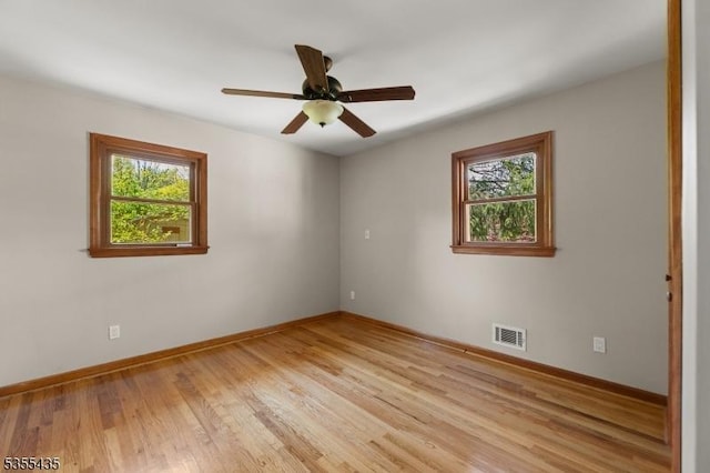 1296 Millstone River Rd, Hillsborough Twp, NJ 08844 - empty room with plenty of natural light, visible vents, baseboards, and light wood-style floors