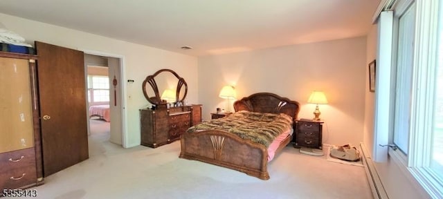 bedroom with light colored carpet