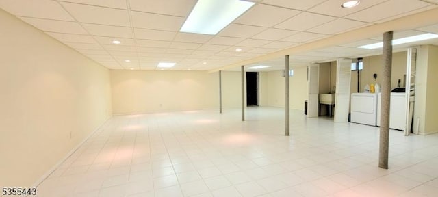 finished below grade area featuring independent washer and dryer, recessed lighting, and a drop ceiling