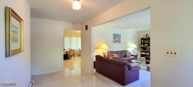 living area featuring light tile patterned floors