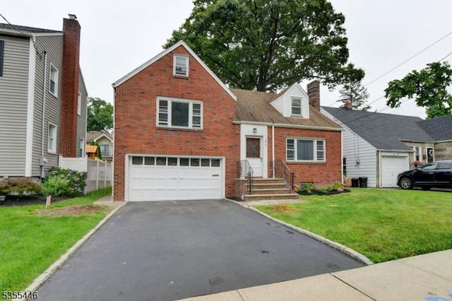 377 Delaware Ave, Union Twp, NJ 07083 - view of front of house featuring brick siding, an attached garage, asphalt driveway, a front lawn, and a chimney