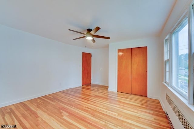 377 Delaware Ave, Union Twp, NJ 07083 - unfurnished bedroom with radiator, light wood-style floors, and ceiling fan