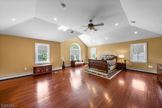 bedroom featuring vaulted ceiling, baseboard heating, visible vents, and wood finished floors