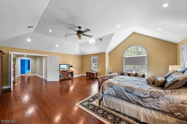 bedroom with ceiling fan, vaulted ceiling, wood finished floors, and visible vents