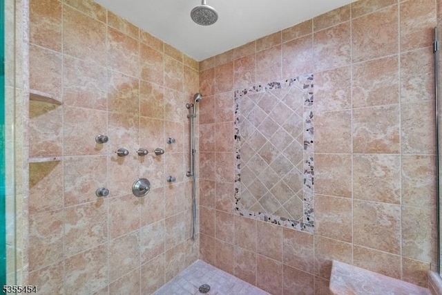 full bathroom with a tile shower