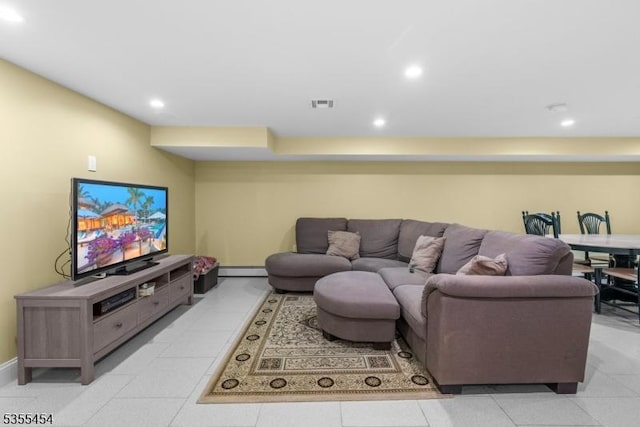 living area featuring recessed lighting, baseboards, visible vents, and baseboard heating