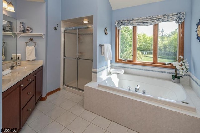 bathroom featuring double vanity, a garden tub, a shower stall, and tile patterned floors