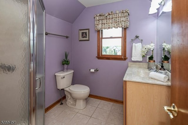 bathroom with toilet, lofted ceiling, vanity, a shower stall, and baseboards