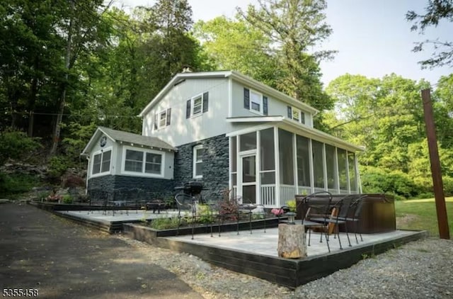 14 Luchetti Way, Andover Twp, NJ 07860 - rear view of property with a sunroom, a deck, and stone siding