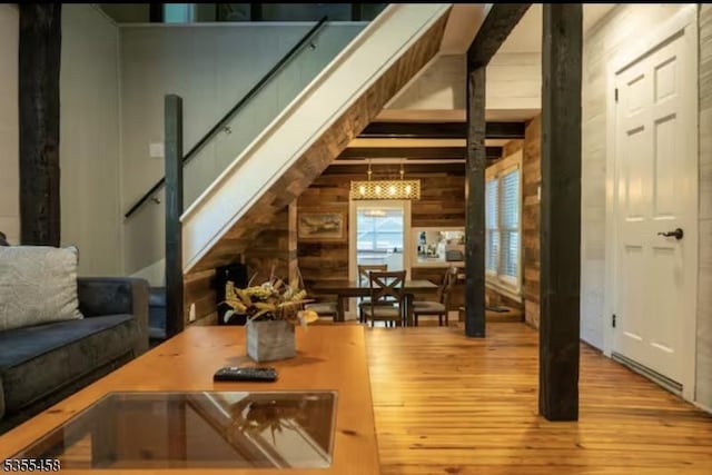 14 Luchetti Way, Andover Twp, NJ 07860 - interior space featuring wood walls, beam ceiling, wood-type flooring, a notable chandelier, and stairs