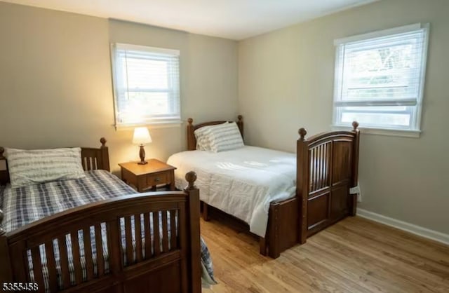 14 Luchetti Way, Andover Twp, NJ 07860 - bedroom with baseboards, multiple windows, and wood finished floors