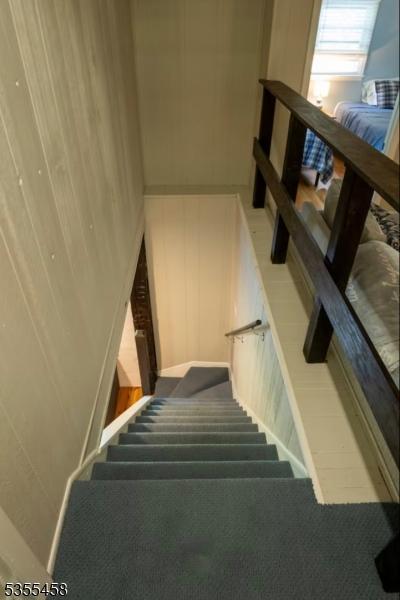 14 Luchetti Way, Andover Twp, NJ 07860 - staircase featuring carpet floors and a decorative wall