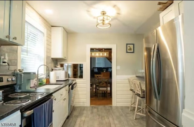 14 Luchetti Way, Andover Twp, NJ 07860 - kitchen featuring a sink, appliances with stainless steel finishes, white cabinets, and dark countertops