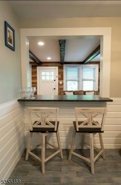 14 Luchetti Way, Andover Twp, NJ 07860 - bar featuring a dry bar, wainscoting, wood finished floors, and wood walls