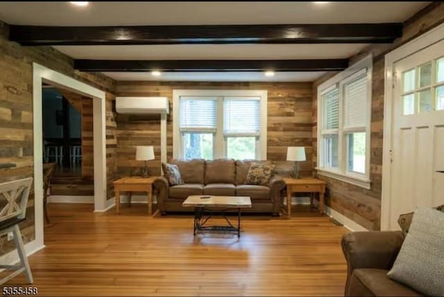 14 Luchetti Way, Andover Twp, NJ 07860 - living area featuring an AC wall unit, wood walls, light wood-style floors, and beamed ceiling