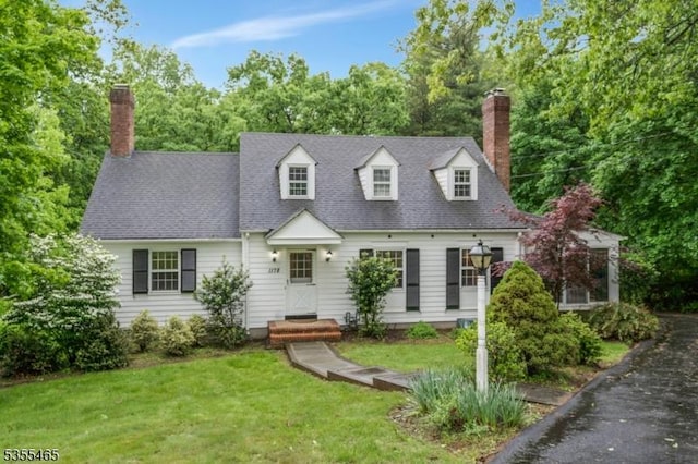 1178 Delaware Dr, Bridgewater Twp, NJ 08807 - cape cod house featuring a chimney and a front lawn