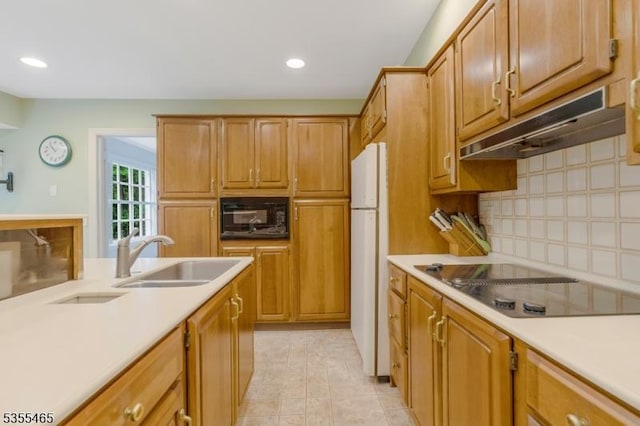 1178 Delaware Dr, Bridgewater Twp, NJ 08807 - kitchen with black appliances, a sink, under cabinet range hood, light countertops, and decorative backsplash