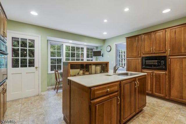 1178 Delaware Dr, Bridgewater Twp, NJ 08807 - kitchen with black microwave, a sink, recessed lighting, a kitchen island with sink, and plenty of natural light