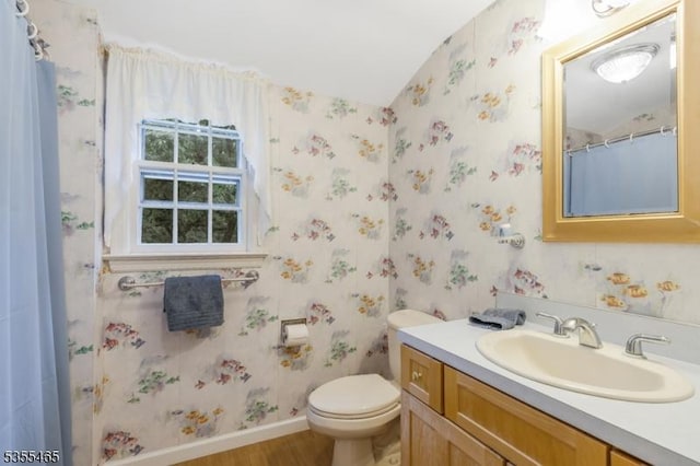 1178 Delaware Dr, Bridgewater Twp, NJ 08807 - bathroom featuring wallpapered walls, wood finished floors, baseboards, toilet, and vanity