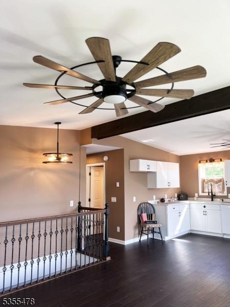 1 Lenape Ln, Harmony Twp, NJ 08865 - kitchen with white cabinets, light countertops, dark wood-type flooring, baseboards, and ceiling fan