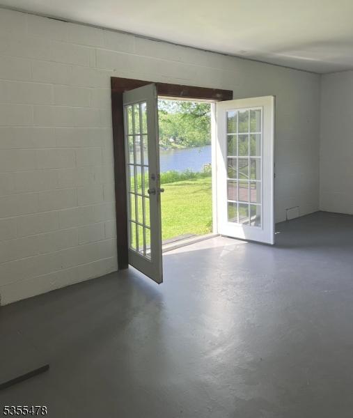 1 Lenape Ln, Harmony Twp, NJ 08865 - spare room with concrete floors, healthy amount of natural light, and concrete block wall
