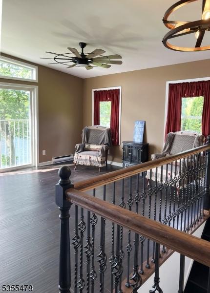 1 Lenape Ln, Harmony Twp, NJ 08865 - stairs with a ceiling fan, a baseboard radiator, wood finished floors, and baseboards