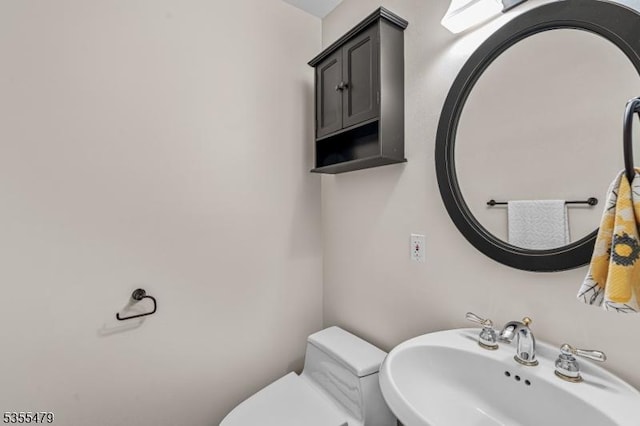 bathroom with a sink and toilet