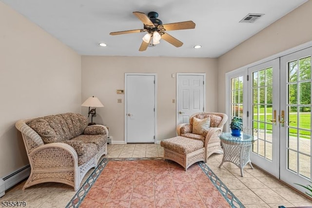 sitting room featuring french doors, baseboard heating, ceiling fan, light tile patterned floors, and recessed lighting