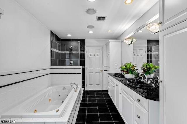 full bath featuring a whirlpool tub, a shower stall, double vanity, recessed lighting, and tile patterned flooring