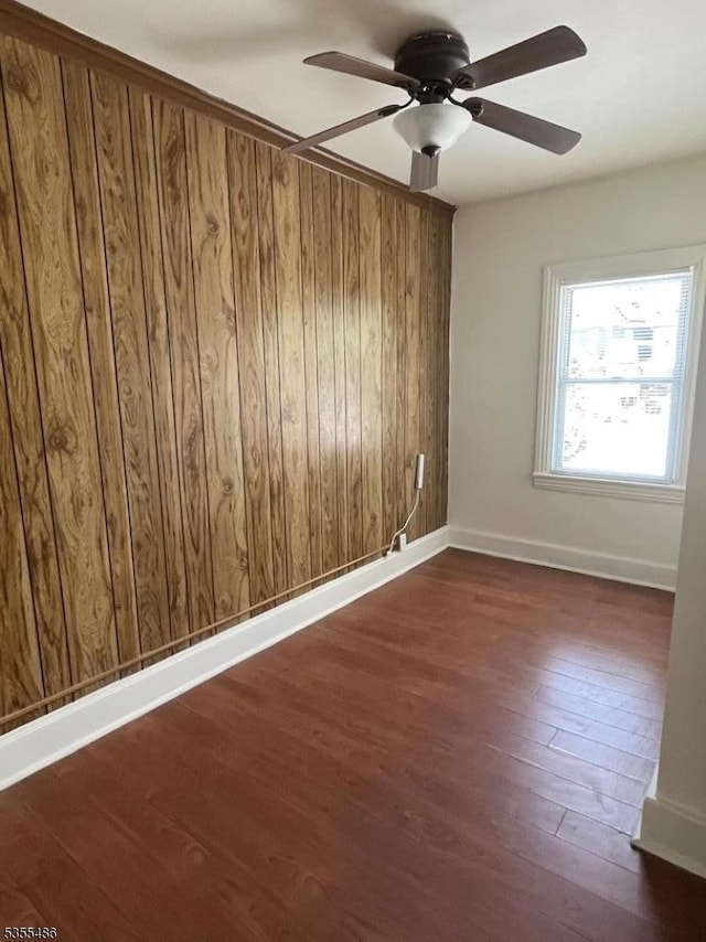 105 Chambers St, Phillipsburg Town, NJ 08865 - unfurnished room with a ceiling fan, dark wood-type flooring, wooden walls, and baseboards