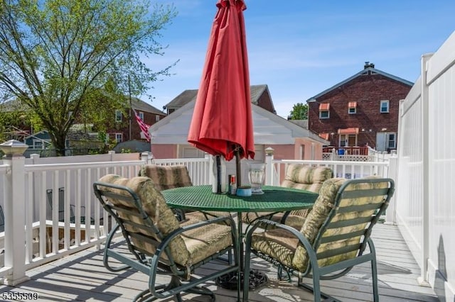 wooden deck featuring outdoor dining space