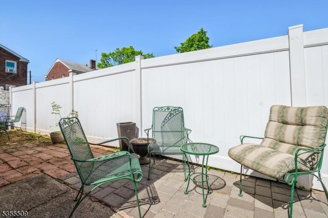 view of patio / terrace featuring fence