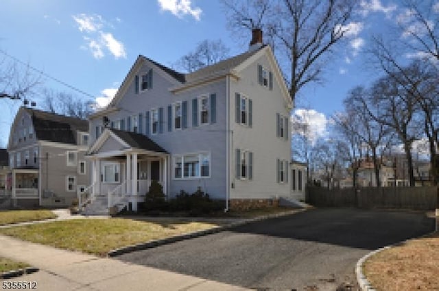 view of front of home with a chimney