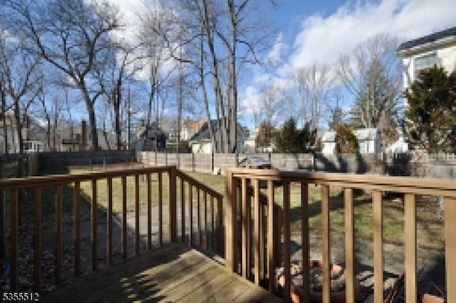 wooden terrace with a residential view