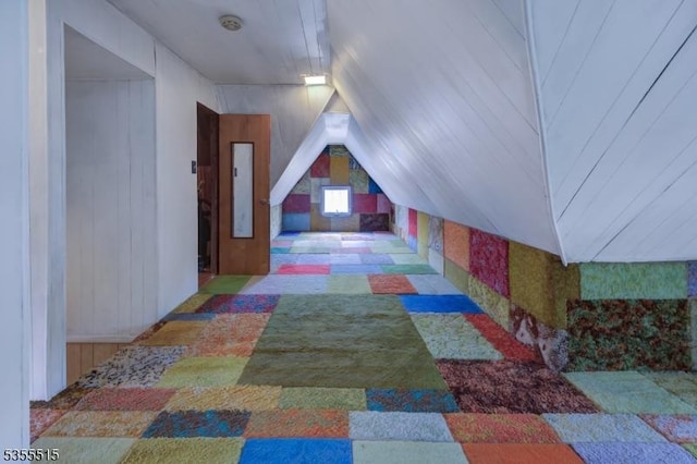 additional living space featuring lofted ceiling