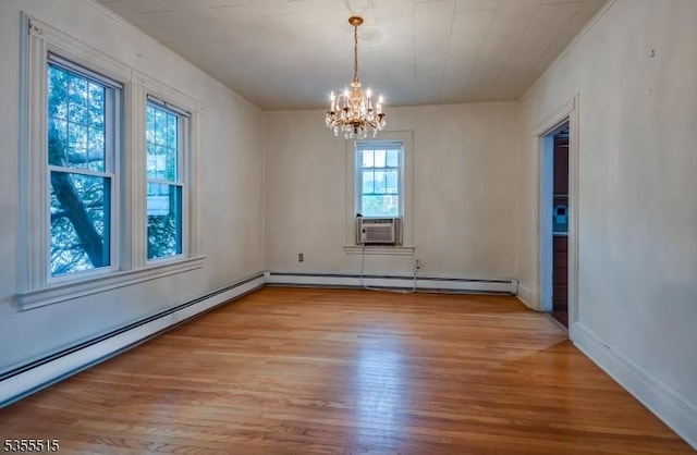 interior space with light wood-style floors, a chandelier, baseboard heating, and cooling unit