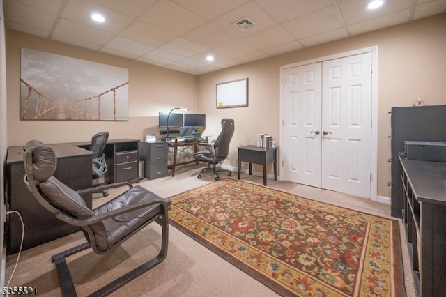 office featuring carpet flooring, a drop ceiling, and recessed lighting
