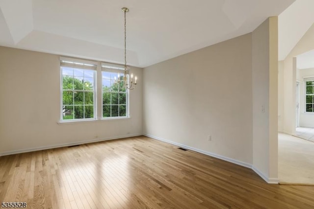 9 Apgar Ct, Raritan Twp, NJ 08822 - empty room featuring a chandelier, wood-type flooring, and baseboards