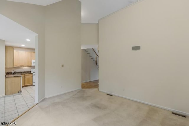 9 Apgar Ct, Raritan Twp, NJ 08822 - unfurnished living room featuring baseboards, stairs, recessed lighting, and light carpet