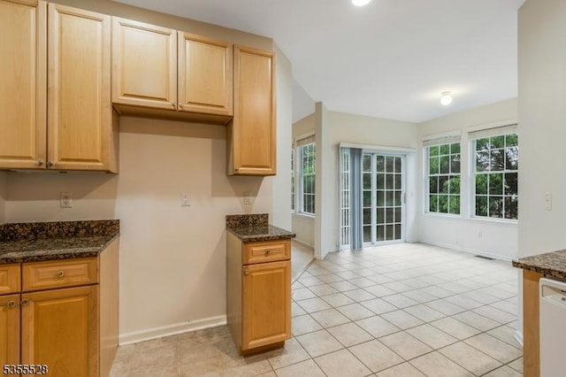 9 Apgar Ct, Raritan Twp, NJ 08822 - kitchen with dishwasher, dark stone countertops, baseboards, light tile patterned flooring, and light brown cabinets