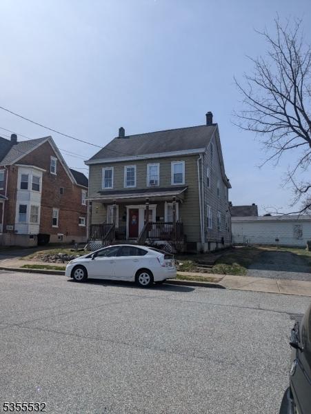 1115-17 E Blvd Unit 2, Alpha Boro, NJ 08865 - view of front of home featuring a chimney and covered porch