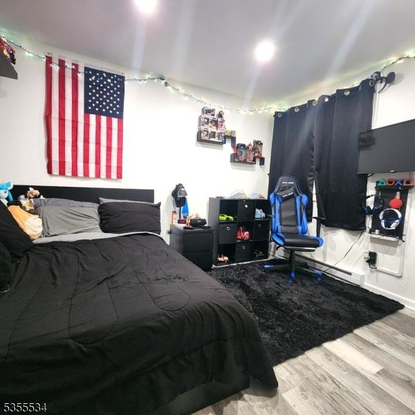 bedroom with wood finished floors