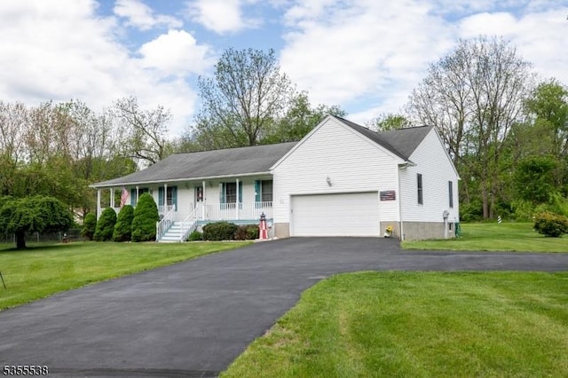 single story home with a porch, an attached garage, driveway, and a front yard
