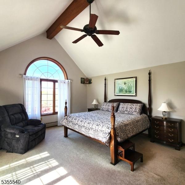 202 Fredon Springdale Rd, Fredon Twp, NJ 07860 - carpeted bedroom with baseboard heating, a ceiling fan, and lofted ceiling with beams